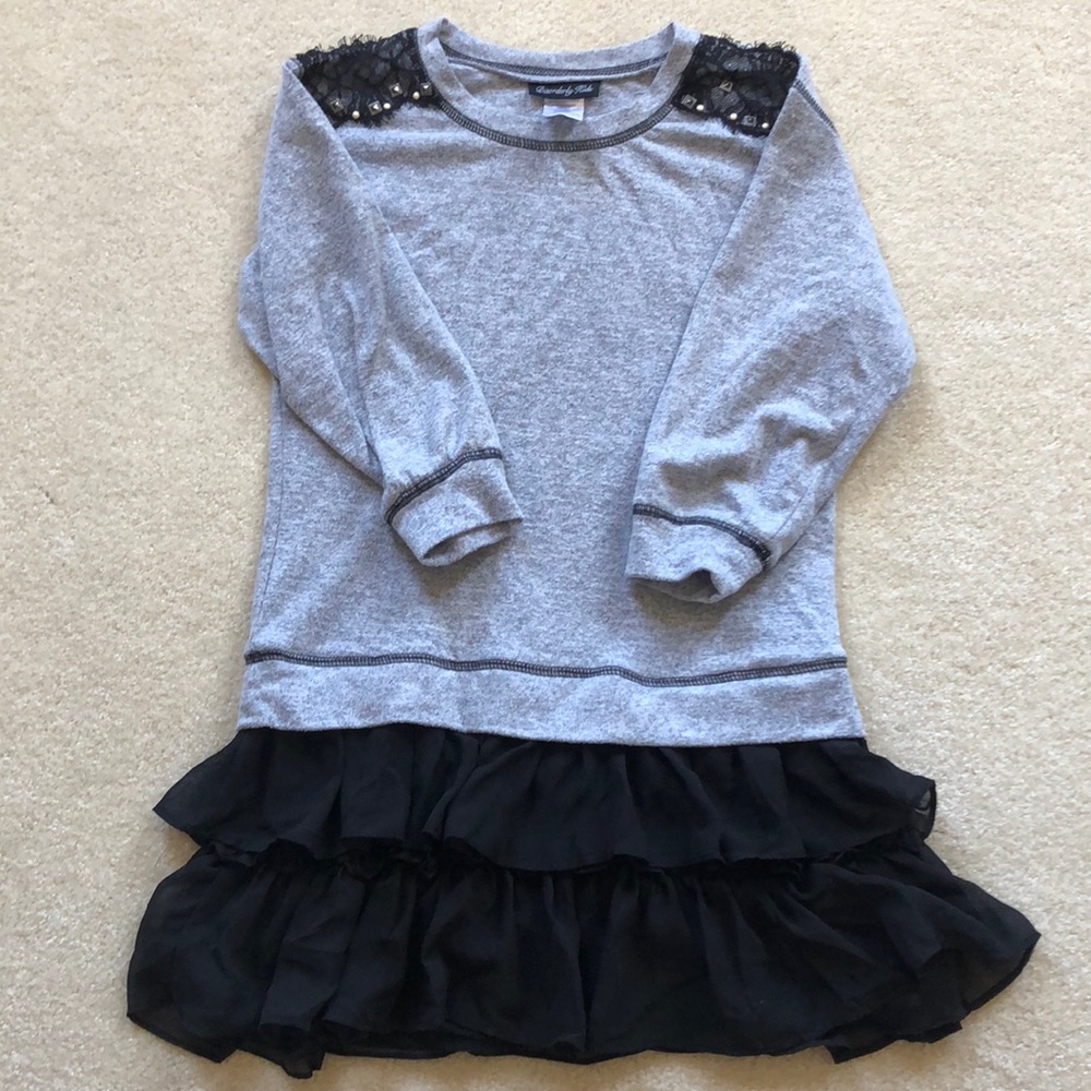 A light gray with black ruffled bottom dress.